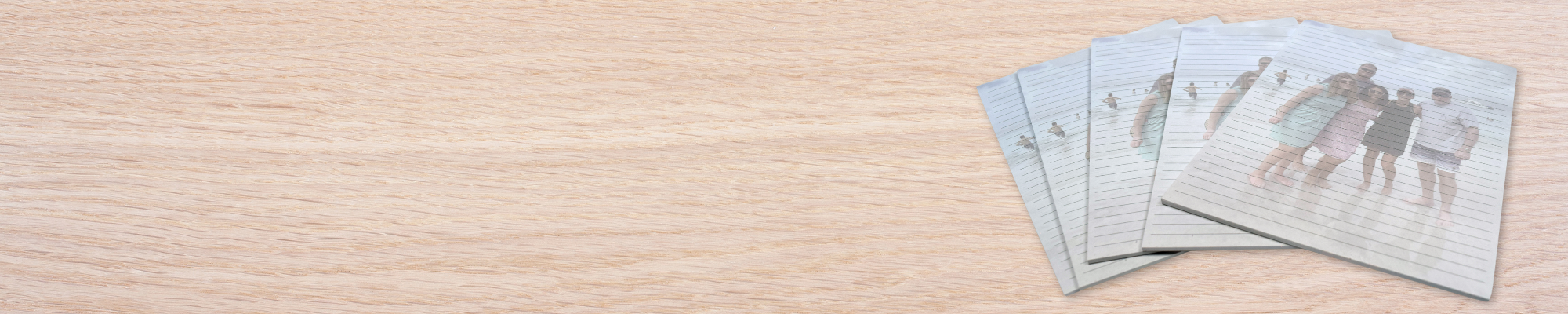 wooden table with several notepads